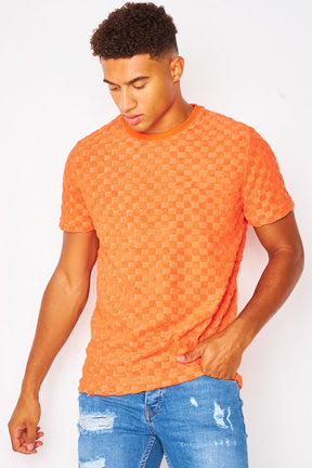 T-shirt orange imprimé damier en relief